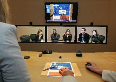 
Hewlett-Packard employees share a document during a virtual conference with Porter Novelli and Hewlett-Packard employees on Monday. 
 (Associated Press / The Spokesman-Review)