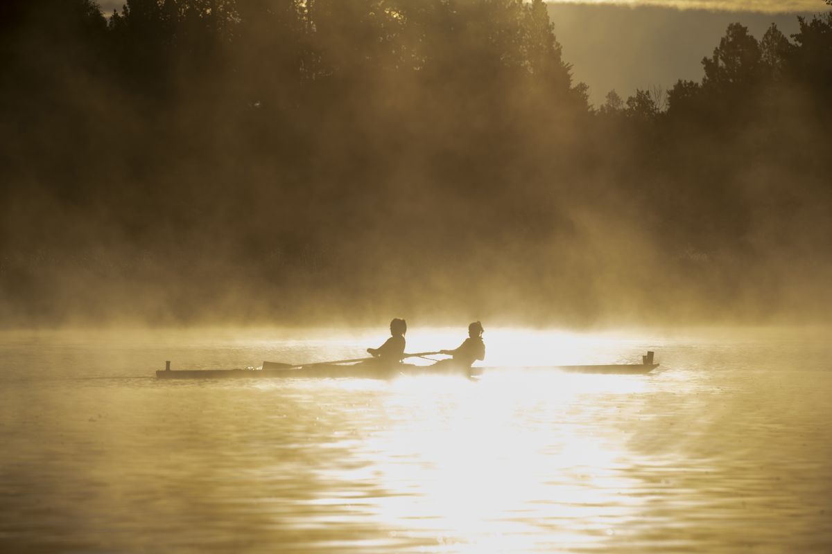 Starting well before dawn, Gonzaga rowers work out in the fog as the sun breaks over the trees Thursday, Oct. 14, 2021 on Silver Lake .  (JESSE TINSLEY/THE SPOKESMAN-REVIEW)