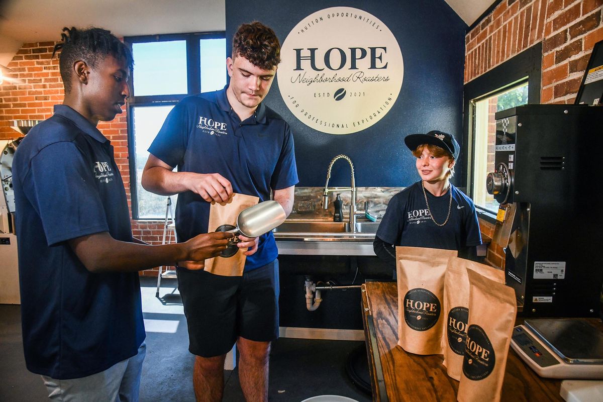 Hutton Settlement students Parker Ritzmann, 18, left, Kale Green, 17, and Roxy Frederickisen, 17, demonstrate packaging coffee for their new HOPE (Hutton Opportunities for Professional Exploration) program. The students are running their own coffee roasting business that teaches job creation, entrepreneurship and cultural competencies while raising money for the children’s home.  (Dan Pelle/THE SPOKESMAN-REVIEW)