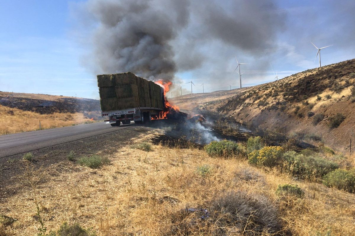 A hay truck fire led to a brief closure of all lanes of Interstate 90 six miles west of Vantage on Wednesday afternoon. (Courtesy of Washington State Patrol Trooper John Bryant)