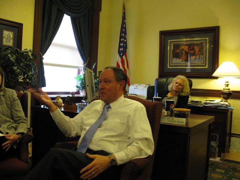 Idaho Treasurer Ron Crane answers questions from reporters in his office on Monday (Betsy Russell)