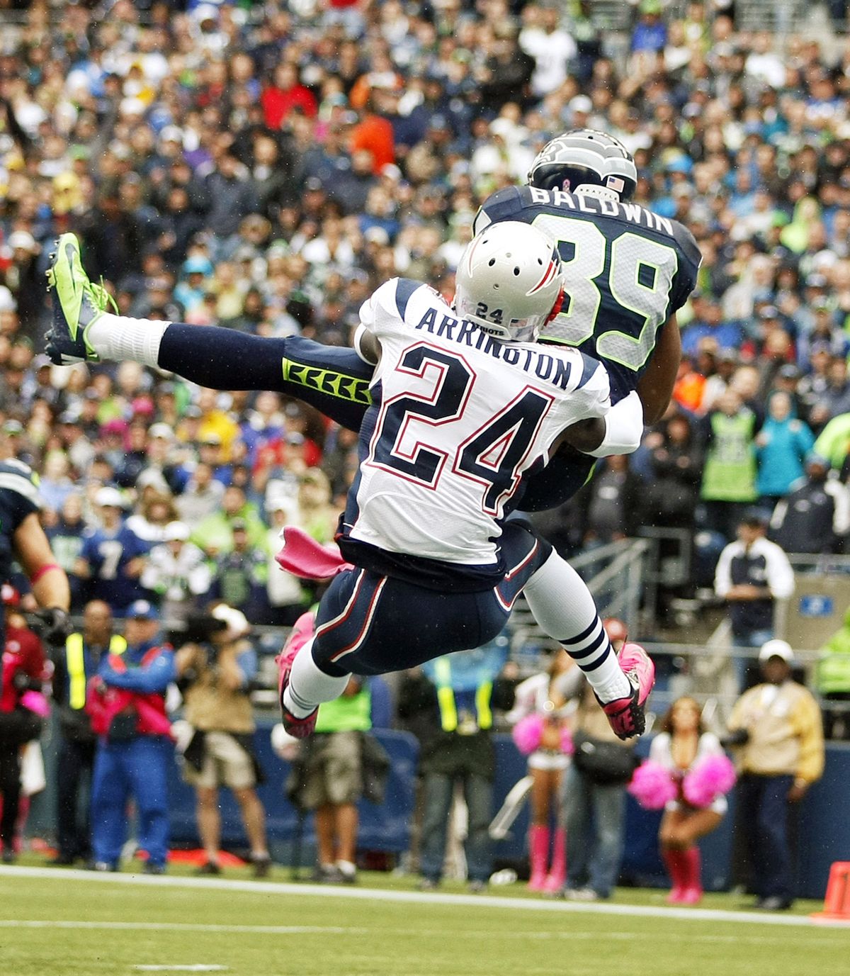 Seahawks receiver Doug Baldwin hauls in a TD pass over Patriots cornerback Kyle Arrington in first quarter Sunday. (Associated Press)