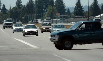 
A truck crosses median-divided U.S. Highway 95, filled with cars traveling north and south at 55 mph, in Hayden at Wyoming Avenue on Friday. The Idaho Transportation Department is discussing dangers at this and other uncontrolled intersections and whether to close the crossings. 
 (Jesse Tinsley / The Spokesman-Review)