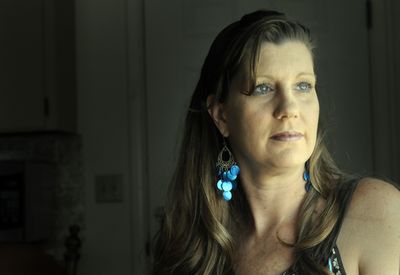 Kristine Deem, who lives in Hayden, is struggling with breast cancer. She asked that cysts removed from her breasts be tested for malignancy, and that action may have saved her life.  (Jesse Tinsley / The Spokesman-Review)