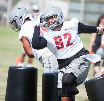WSU nose tackle Robert Barber (92) runs through drills during practice on Saturday, Aug. 6, 2016, at Sacajawea Junior High School in Lewiston. (Tyler Tjomsland/SR file photo)