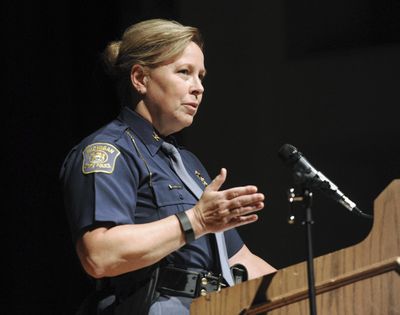 FILE- In an Oct. 1, 2015 file photo, Michigan State Police Director Col. Kriste Kibbey Etue leads a focus group discussion at Benton Harbor High School, in Benton Harbor, Mich. (Don Campbell / Associated Press)