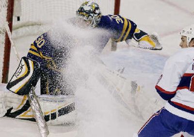 
 Canadiens' Mike Johnson, right, kicks ice into the face of  Sabres goalie Ryan Miller.
 (Associated Press / The Spokesman-Review)