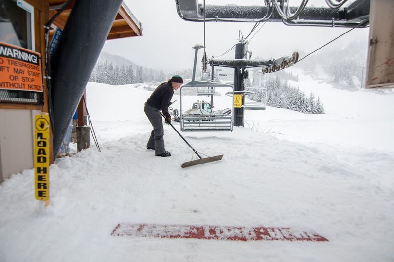 Stevens Pass workers clear powder snow from facilities for the resort's season opener on Dec. 4, 2015. (Stevens Pass Mountain Resort)