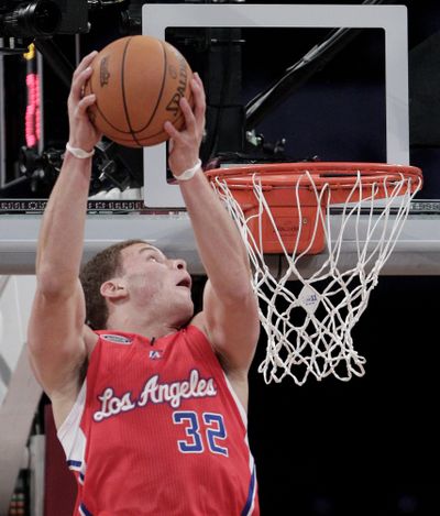 Blake Griffin dunks the ball during the Rookie Challenge. (Associated Press)