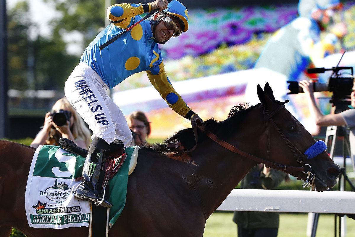 Victor Espinoza reacts after crossing the finish line with American Pharoah to win the 147th running of the Belmont Stakes horse race at Belmont Park. (AP)