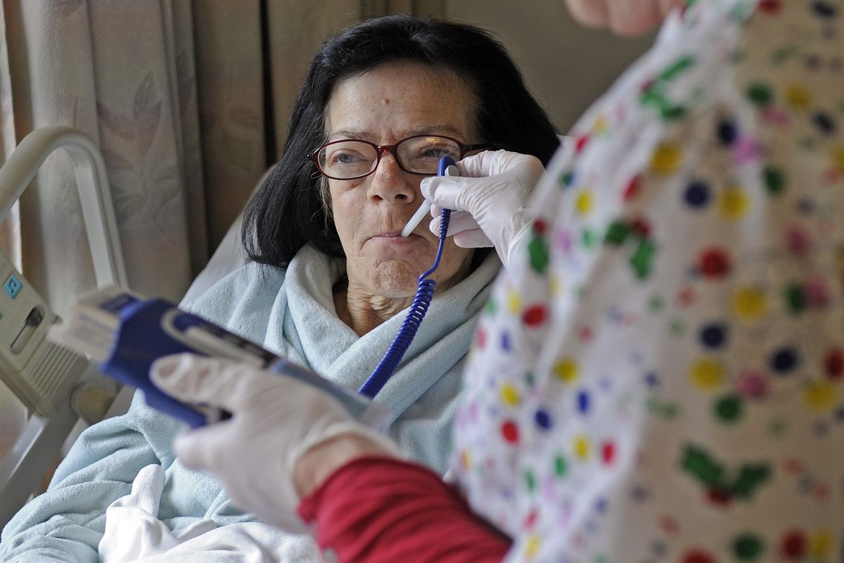 Terissa Norris has her temperature checked last Wednesday at Providence St. Joseph Hospital in Chewelah, Wash. Norris fears that cuts in health care will eliminate smaller hospitals like St. Joseph and she would be forced to travel to Spokane for health care. (Christopher Anderson)