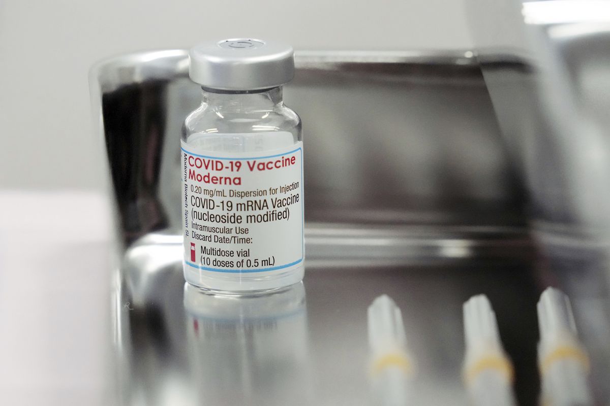 FILE - This June 14, 2021, file photo shows a Moderna COVID-19 vaccine vial that is being administered for flight attendants of Japan Airlines ar Haneda Airport in Tokyo. Japan’s health ministry said Thursday, Aug. 26, 2021 that it is suspending use of about 1.63 million doses of COVID-19 vaccine produced by Moderna Inc. after contamination was found in portions of unused vials, raising concern of a supply shortage as the country desperately tries to accelerate vaccinations amid the surge of infections.  (Eugene Hoshiko)