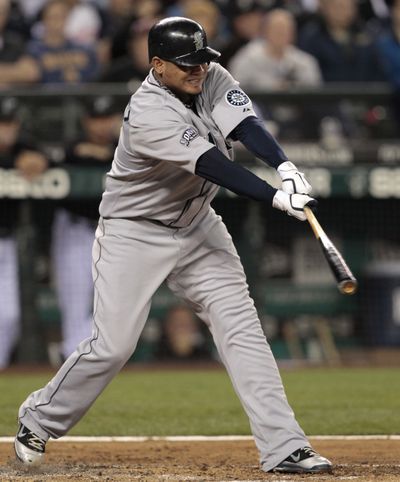 Seattle Mariners' Felix Hernandez singles against the Florida Marlins in the third inning of game Friday, June 24, 2011, in Seattle. (Elaine Thompson / Associated Press)