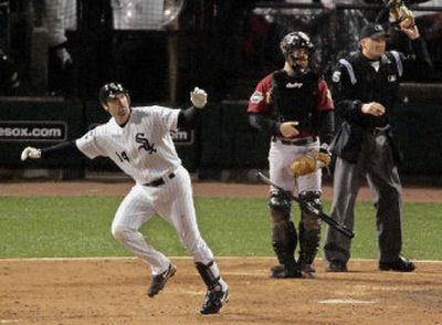 
Chicago's Paul Konerko flips away the bat and watches his seventh-inning grand slam fly away on Sunday night.
 (Associated Press / The Spokesman-Review)