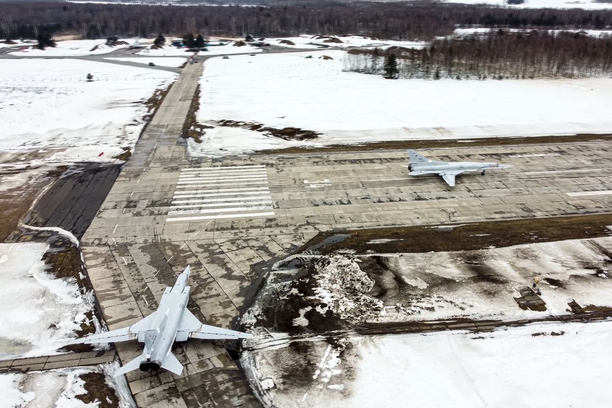 In this photo taken from video and released by the Russian Defense Ministry Press Service on Saturday, Feb. 5, 2022, A pair of Tu-22M3 bombers of the Russian air force taxi before takeoff at an air base in Russia. Two Tu-22M3 long-range bombers of the Russian air force performed a patrol mission over Belarus on Saturday amid the tensions over Ukraine. (HOGP)