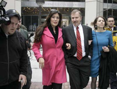 
Former Alaska state lawmaker Pete Kott, center, walks from the federal court building in Anchorage,  on Tuesday with his daughter and wife after being convicted of  accepting bribes. Associated Press
 (Associated Press / The Spokesman-Review)