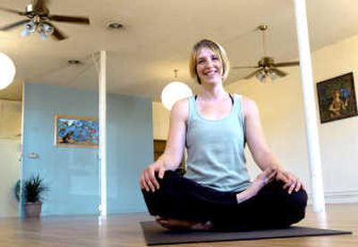 
Sara Hawson, owner of the Mellow Monkey Yoga Studio in Millwood, poses in her studio Monday. The yoga studio opened in June. 
 (Joe Barrentine / The Spokesman-Review)