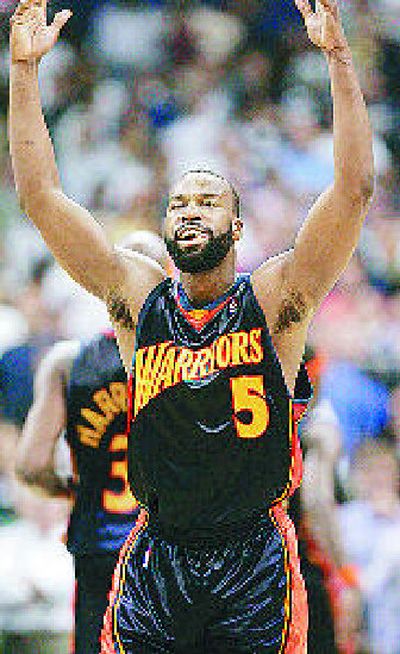 
Warriors guard Baron Davis celebrates a first-game victory. 
 (Associated Press / The Spokesman-Review)