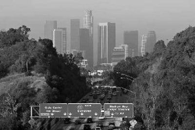 
Traffic flows into downtown Los Angeles. Scientists with the Environmental Protection Agency are due to recommend today a range of options for healthier air by tightening smog standards nationally. 
 (Associated Press / The Spokesman-Review)