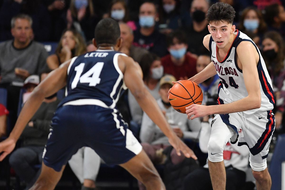 Gonzaga center Chet Holmgren (34) moves the ball downcourt against Dixie State on Tuesday.  (Tyler Tjomsland / The Spokesman-Review)