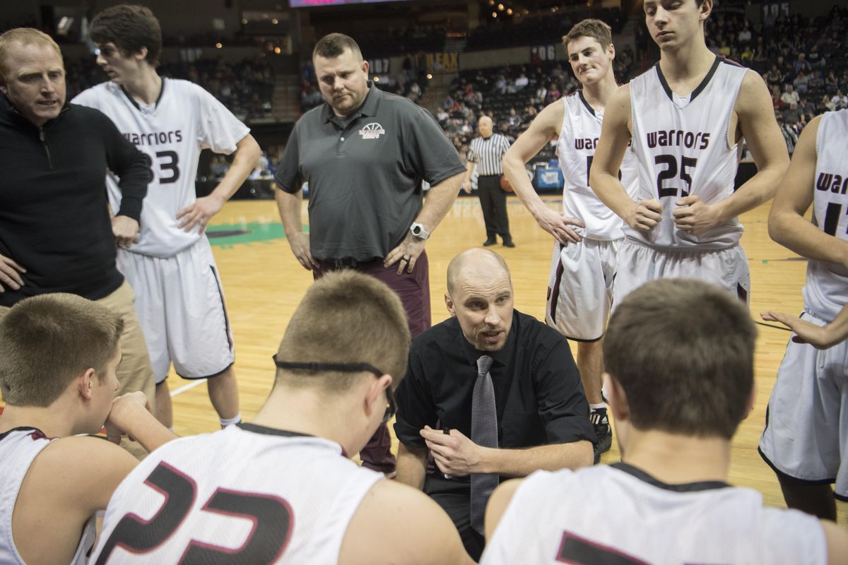Coach Graham Grindy, center, talks to his team in the closing minutes of their win over Taholah in the 2018 1B 2B Boys Hardwood Classic Wednesday, Feb. 28, 2018 at the Spokane Arena.  ACH beat the Taholah Chitwhins 69-40.  Jesse Tinsley/THE SPOKESMAN-REVIEW (Jesse Tinsley / The Spokesman-Review)