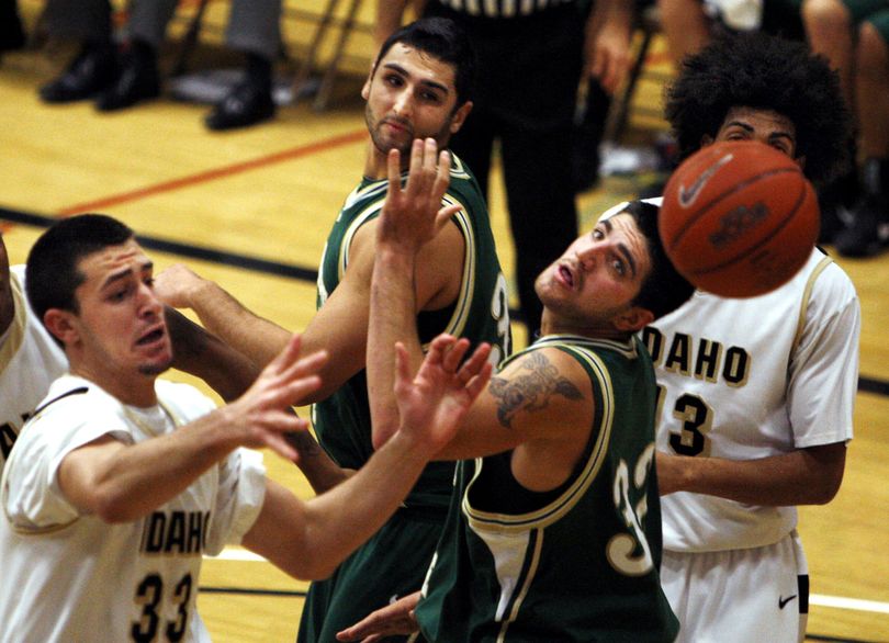 Idaho guard Kyle Barone (left to right), Sacramento State forwards Duro Bjegovic and Michael Selling, and Idaho forward Luciano de Souza look for a rebound during the first half of an NCAA college basketball game Tuesday, Nov. 24, 2009 in Moscow, Idaho. (Dean Hare / Moscow-pullman Daily News)
