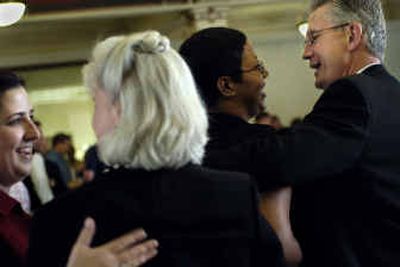 
EWU President Stephen Jordan, right, and his wife, Ruth Jordan, center, talk to well-wishers at a going-away reception at Showalter Hall last month.
 (Holly Pickett / The Spokesman-Review)