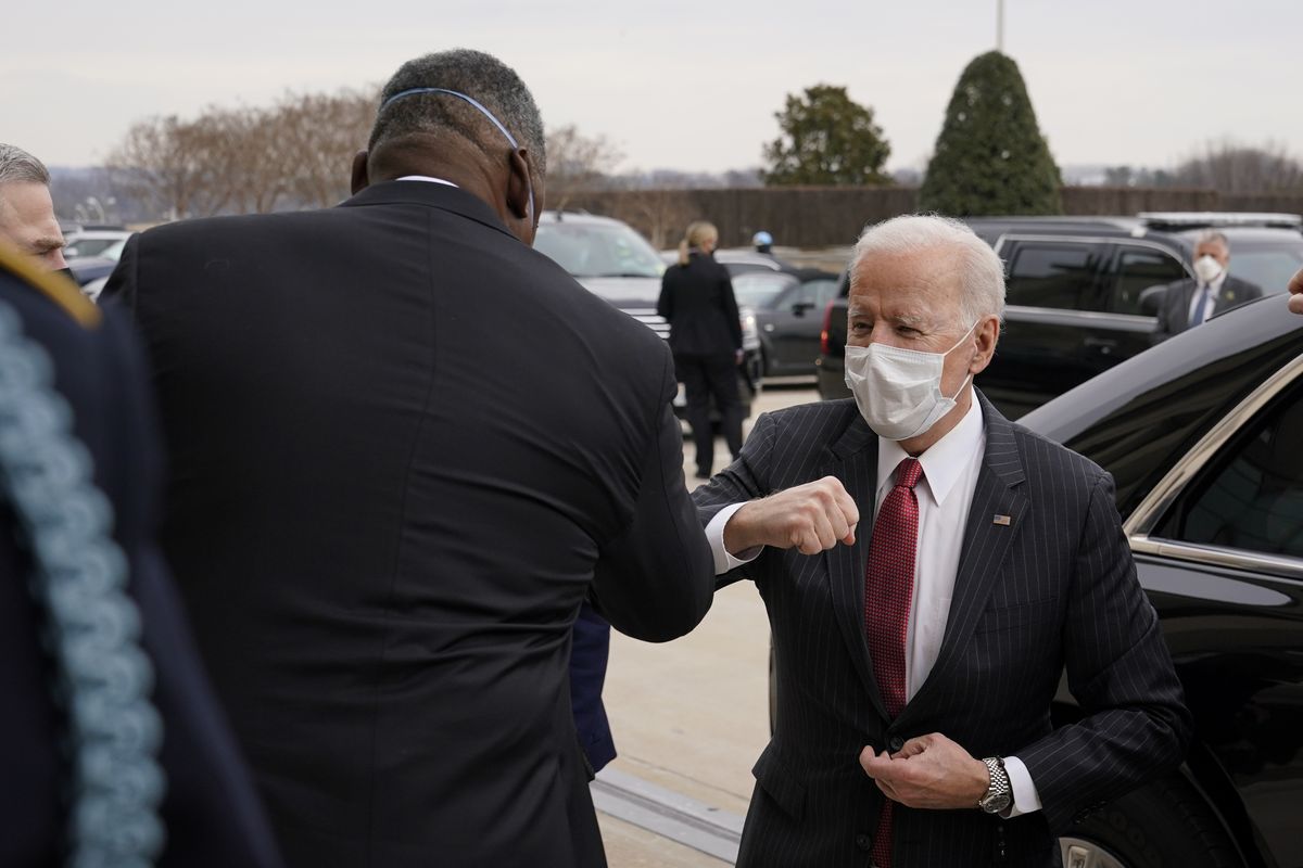 President Joe Biden elbow bumps Defense Secretary Lloyd Austin as he arrives at the Pentagon, Wednesday, Feb. 10, 2021, in Washington. (Patrick Semansky)