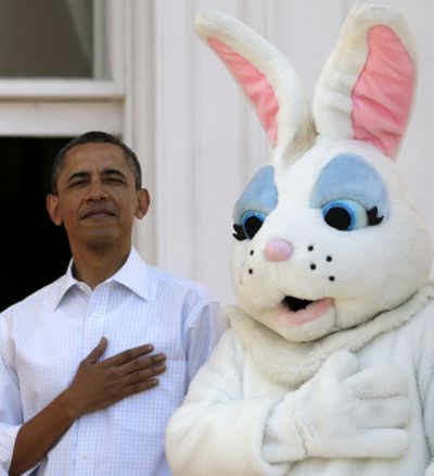 Hare Force One: President Barack Obama stands next to the Easter Bunny during the singing of the national anthem at the White House in Washington on Monday during the Easter Egg Roll. The annual event, first held in 1878, featured a variety of events for about 30,000 kids and parents. (Associated Press)