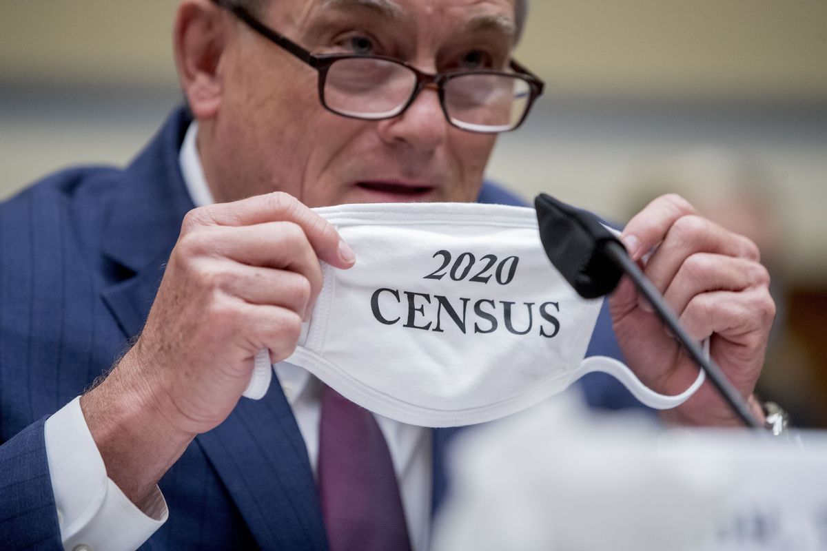 Census Bureau Director Steven Dillingham holds up his mask with the words "2020 Census" as he testifies before a House Committee on Oversight and Reform hearing on the 2020 Census​ on Capitol Hill, Wednesday, July 29, 2020, in Washington.  (Andrew Harnik)