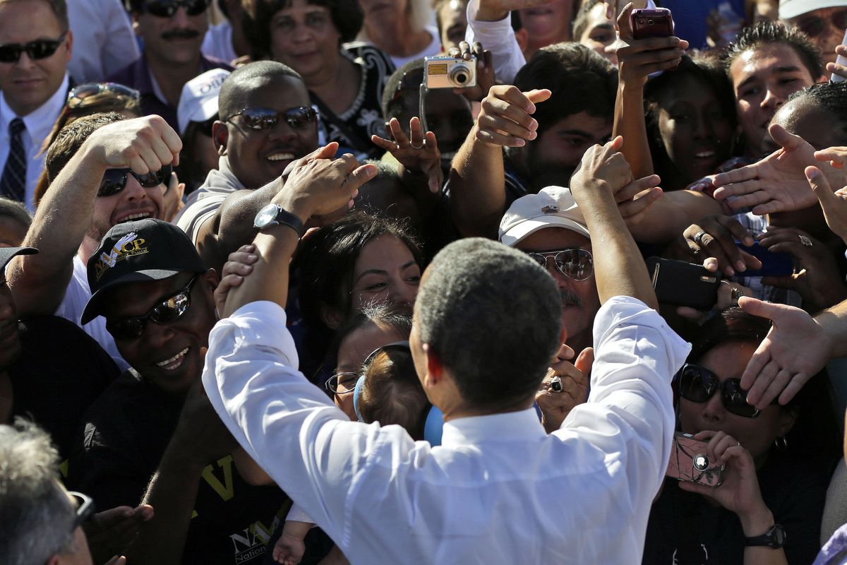 President Barack Obama greets supporters at a campaign event at Cheyenne Sports Complex in Las Vegas, Thursday, Nov. 1, 2012. (Pablo Monsivais / Associated Press)