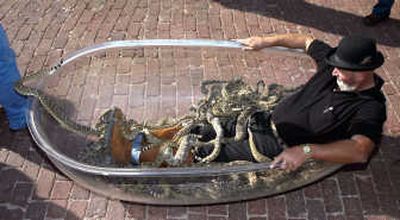 
Jackie Bibby attempts to relax Monday in a see-through bathtub while accompanied by 87 rattlesnakes0 in Dublin, Texas.Associated Press
 (Associated Press / The Spokesman-Review)