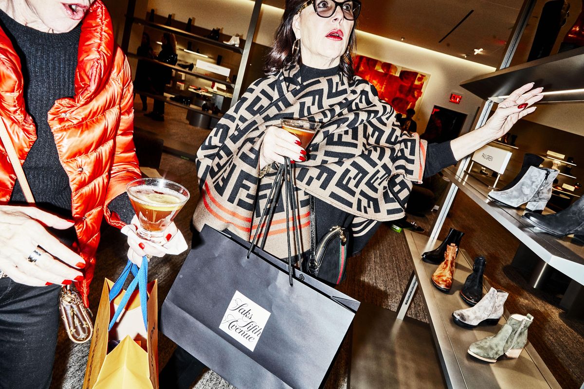 Lora Laukitis and Kathy Miller carry drinks as they shop at Nordstrom in New York City on Jan. 24, 2020. The Nordstrom NYC Flagship store contains seven bars and restaurant. (Amy Lombard / For The Washington Post)