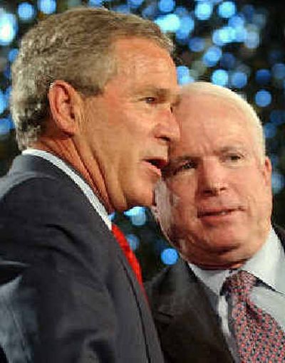 
President Bush and Sen. John McCain, R-Ariz., right, talk Friday onstage at Fort Lewis, Wash.
 (Associated Press / The Spokesman-Review)