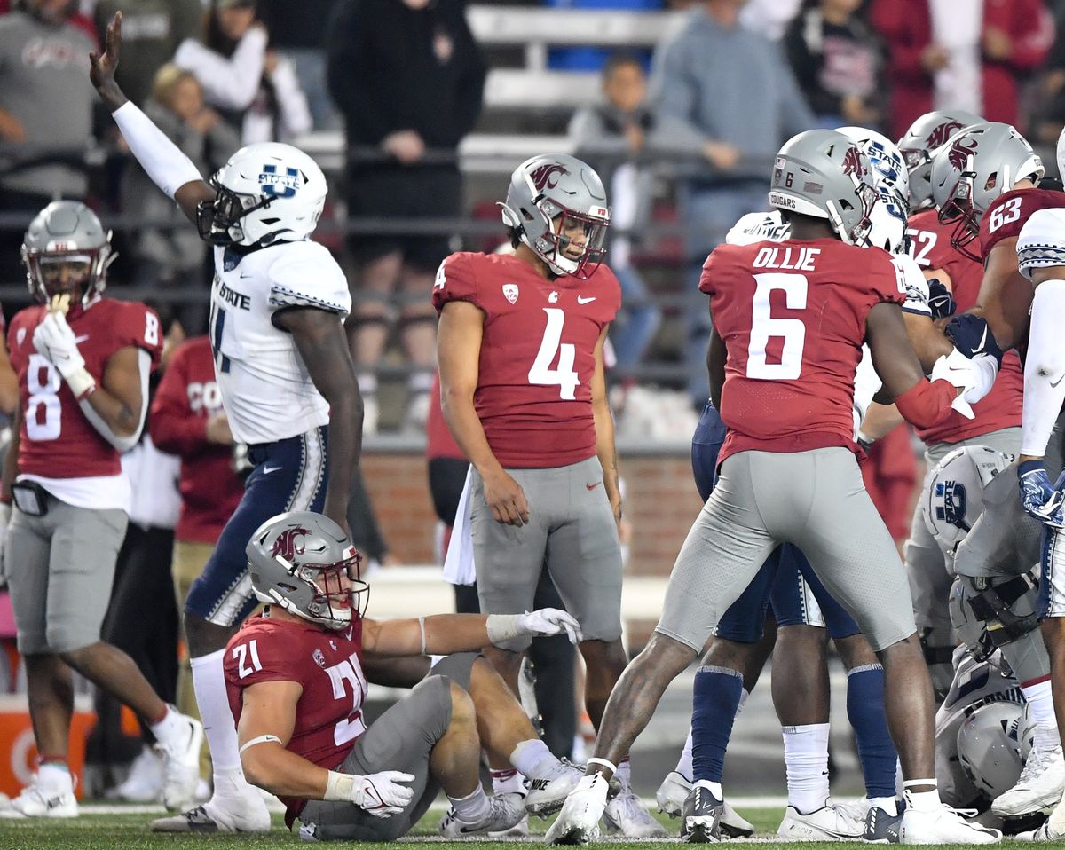 Washington State Cougars quarterback Jayden de Laura (4) reacts on the final play of the game but time ran out and WSU lost after the Utah State Aggies scored a touchdown to defeat WSU in the final seconds of the second half of college football game on Saturday, Sep 4, 2021, at Gesa Field in Pullman, Wash. WSU lost the game 26-23.  (Tyler Tjomsland/The Spokesman-Review)