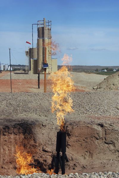 Natural gas is flared from an oil well near Parshall, N.D. (Associated Press)