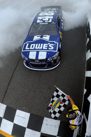 Jimmie Johnson, driver of the #48 Lowe's Chevrolet, celebrates in Victory Lane after winning the NASCAR Sprint Cup Series STP Gas Booster 500 on April 7, 2013 at Martinsville Speedway in Ridgeway, Virginia. (Photo by Rainier Ehrhardt/NASCAR via Getty Images) (Jared Tilton / Nascar)