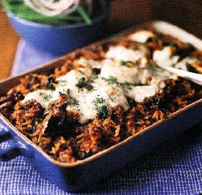 
 Greek Lamb Casserole is a savory one-dish dinner that is a lighter interpretation of pastitsio, a Greek pasta casserole. The original is topped with a heavy cream sauce, but this version bakes under a heart-healthy mixture of yogurt, egg whites and flour.
 (Associated Press / The Spokesman-Review)