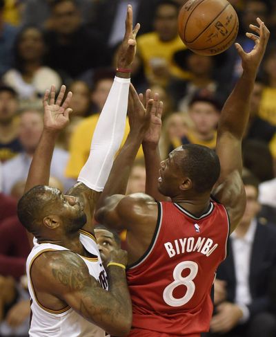 Toronto’s Bismack Biyombo shoots as Cleveland’s LeBron James defends during Game 2 of the Eastern Conference finals, Thursday. (Frank Gunn / Associated Press)