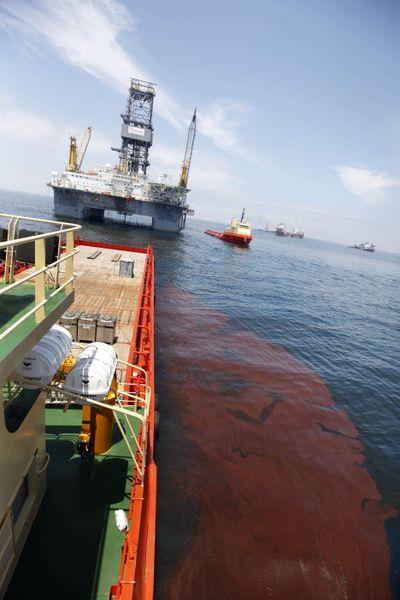 Oil floats around the Joe Griffin at the site of the Deepwater Horizon oil spill in the Gulf of Mexico  on Friday.  (Associated Press)