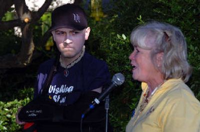 
Branden Joiner, 18, listens to Paula Nordgaarden, executive director of Wishing Star Foundation, speak during a brief ceremony. To celebrate the 1,000th wish granted to a child with a life-threatening illness, the group released doves with the help of Joiner, who will receive his wish to go on a fishing trip to Maine. 
 (Jesse Tinsley / The Spokesman-Review)