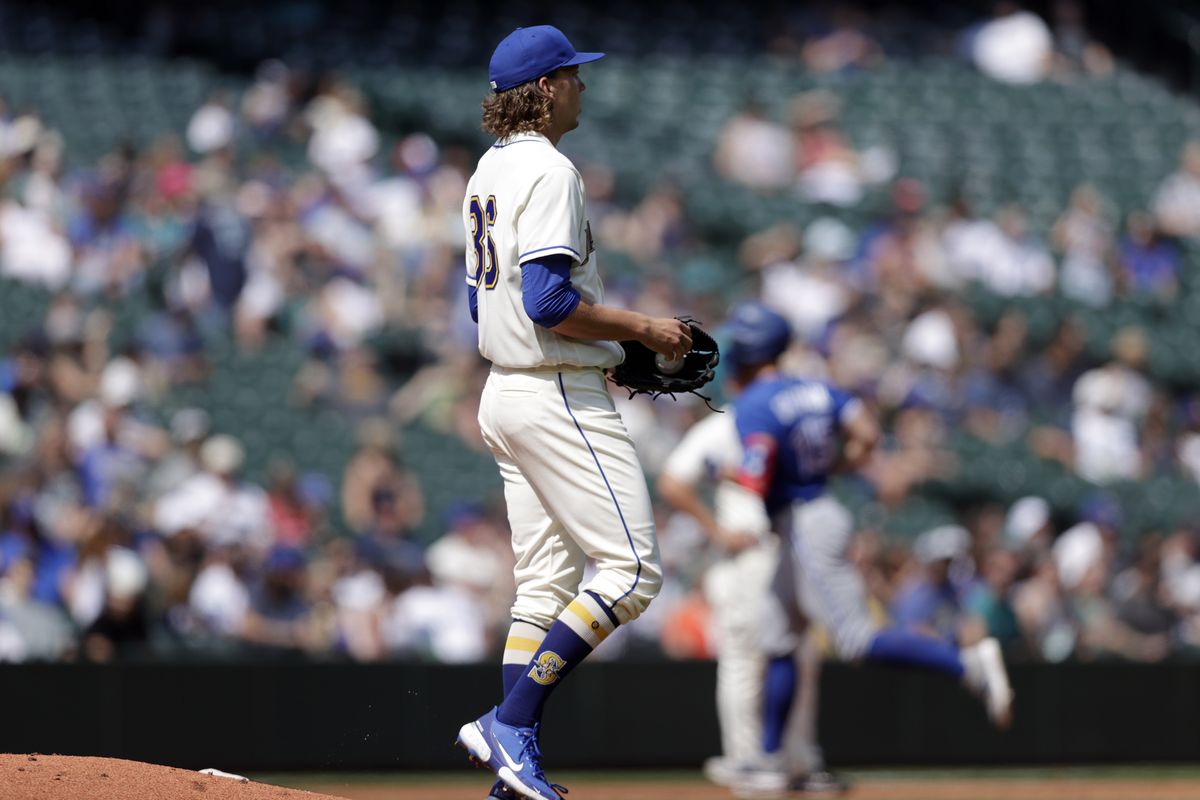 Seattle Mariners starting pitcher Logan Gilbert walks away from the mound after allowing a two-run home run Sunday. (Associated Press)