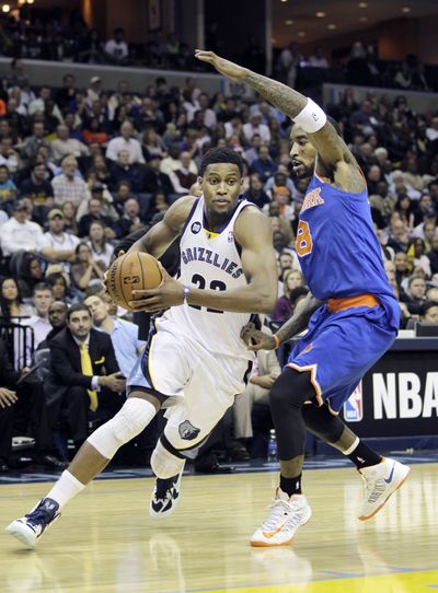 The Memphis Grizzlies’ and Rudy Gay, left, slipped past the New York Knicks on their way to the league’s best record. (Associated Press)