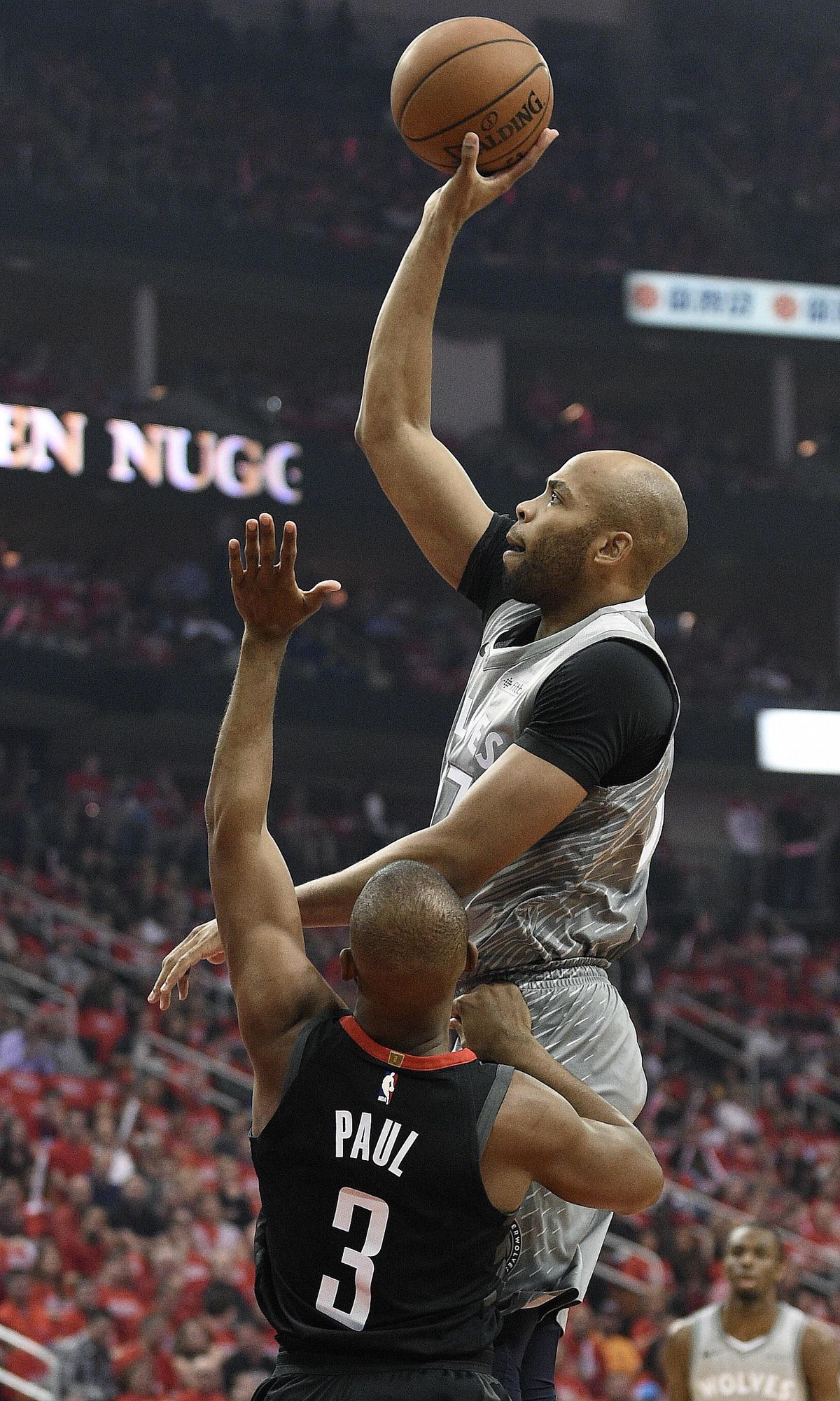 Minnesota Timberwolves forward Taj Gibson shoots over Houston Rockets guard Chris Paul (3) during the first half in Game 2 of a first-round NBA basketball playoff series Wednesday, April 18, 2018, in Houston. (AP Photo/Eric Christian Smith) ORG XMIT: TXES109 (Eric Christian Smith / AP)