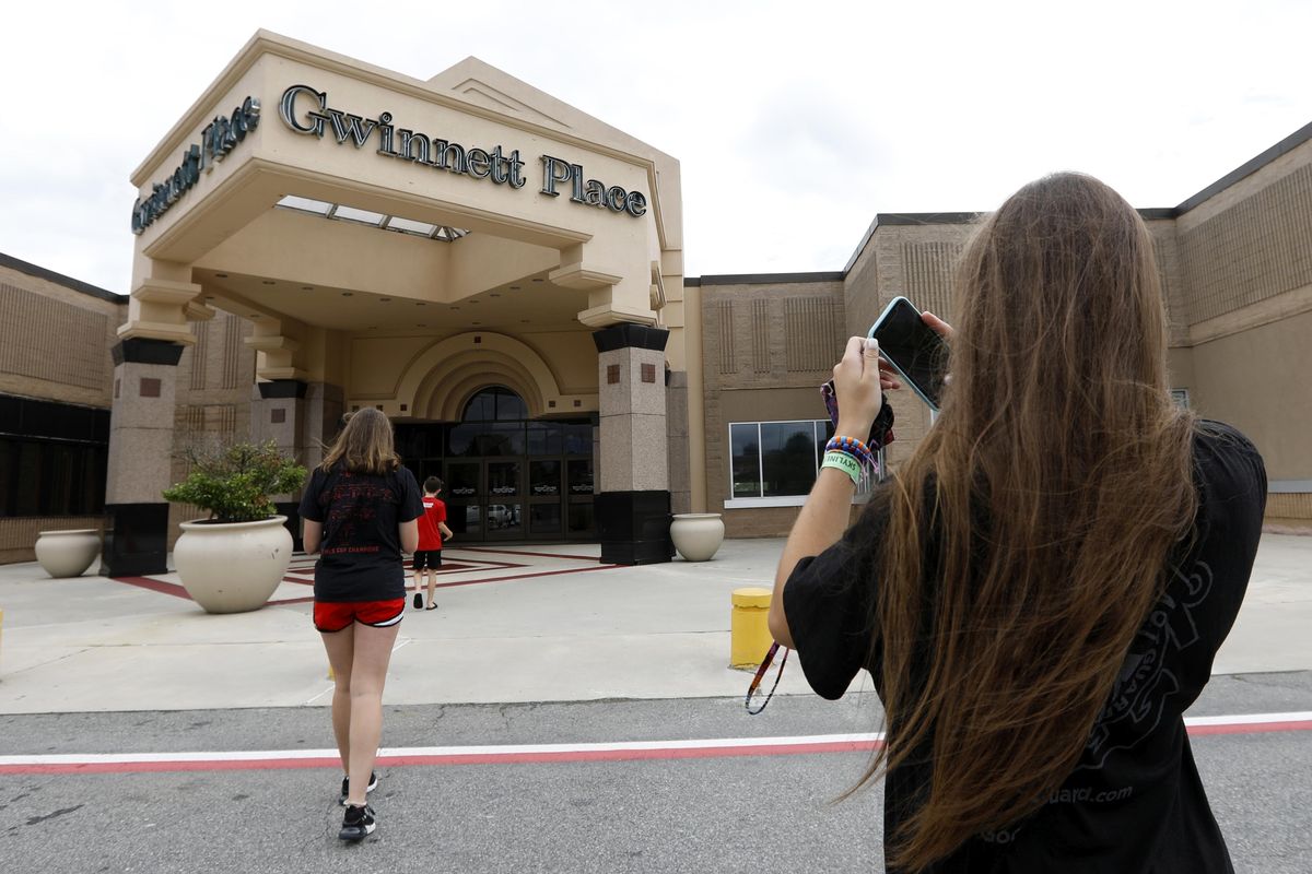 Brinley Rawson,  17, a  “Stranger Things” fan,  snaps a photo of Gwinnett Place Mall in Duluth, Ga., July 23. (Andrea Smith / Associated Press)