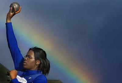 A brilliant rainbow greets Gonzaga Prep shot putter Erica Chaney as she stands in the ring during Friday's District 8 4A track and field championships at University High.
(Christopher Anderson/ / The Spokesman-Review)