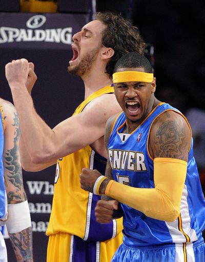 Carmelo Anthony’s joy is Pau Gasol’s agony in Denver’s win Friday. (Associated Press / The Spokesman-Review)