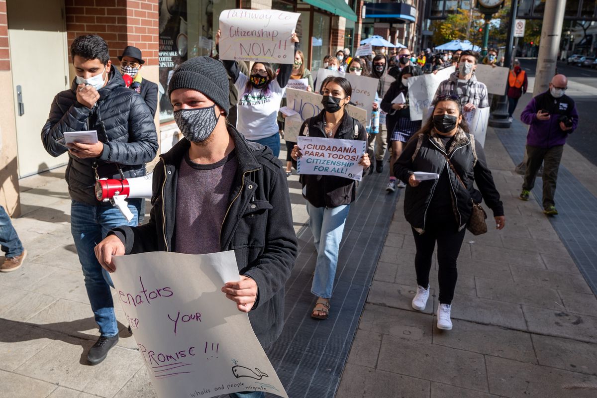 About 40 people marched through downtown Spokane to voice their displeasure with politicians not pursuing immigration reform in Washington, Tuesday, Oct. 12, 2021.  (COLIN MULVANY/THE SPOKESMAN-REVI)