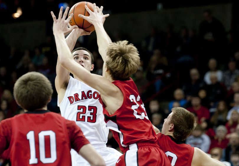 St. George's Erik Muelheims shoots over Lind-Ritzville-Sprague during the first half of the 2013 Washington State 2B boys state basketball game on Friday, March 1, 2013, at Spokane Veterans Memorial Arena in Spokane, Wash. (Tyler Tjomsland / The Spokesman-Review)