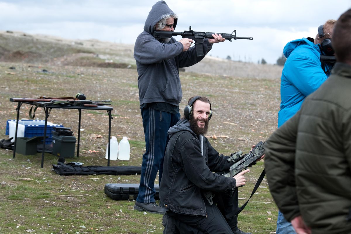 Republican candidate for Congress Jered Bonneau, center, smiles at a supporter during a target shoot meet-and-greet on Saturday, April. 14, 2018, near Fishtrap, Wash. (Tyler Tjomsland / The Spokesman-Review)